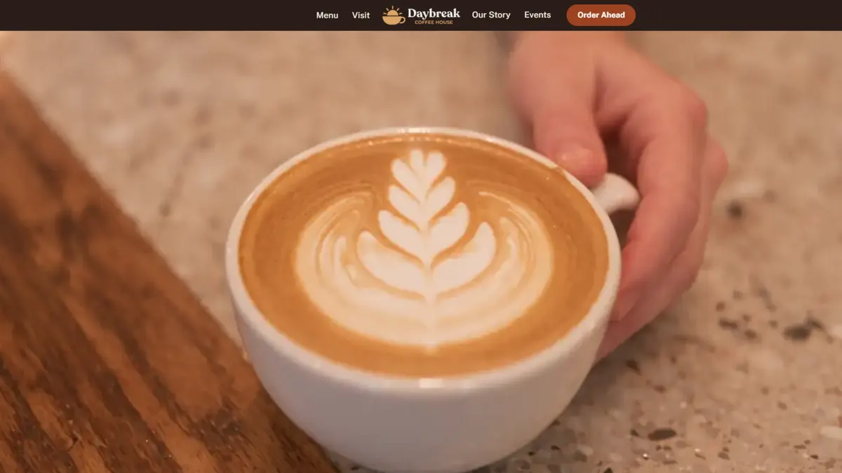 The end of the Daybreak scroll film, a latte finished on the counter